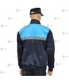 Jersey softshell bicolor color marino y azul tropical con membrana y cinta damero reflectante  para Policía Local