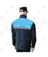 Chaqueta softshell color azul marino y azul tropical con damero reflectante y membrana PU para Policía Local